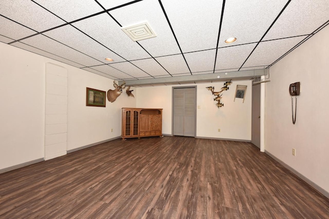 finished basement featuring recessed lighting, baseboards, and wood finished floors