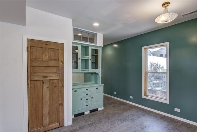 603 Dodge St, Eau Claire, WI 54701 - unfurnished bedroom featuring visible vents and baseboards