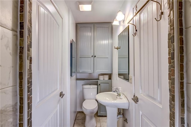603 Dodge St, Eau Claire, WI 54701 - bathroom featuring tile patterned flooring and toilet