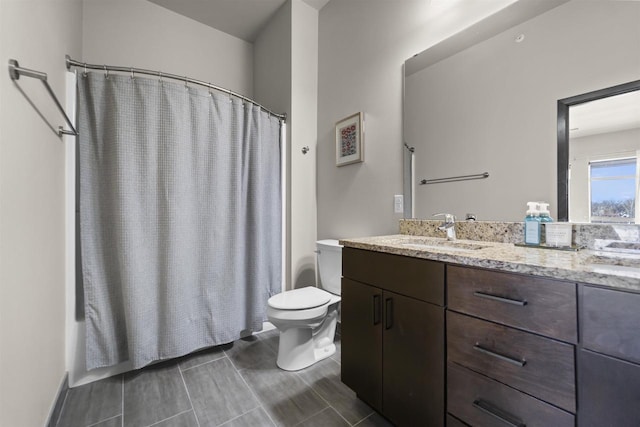 bathroom featuring vanity, toilet, and a shower with curtain