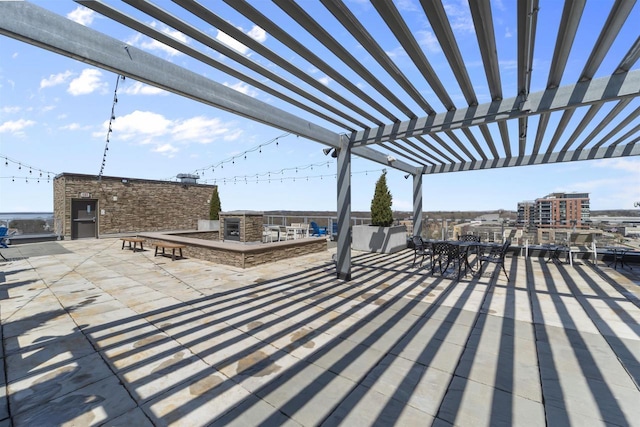 view of patio with outdoor dining area and a pergola