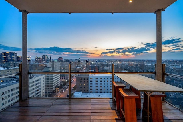 wooden terrace featuring a city view