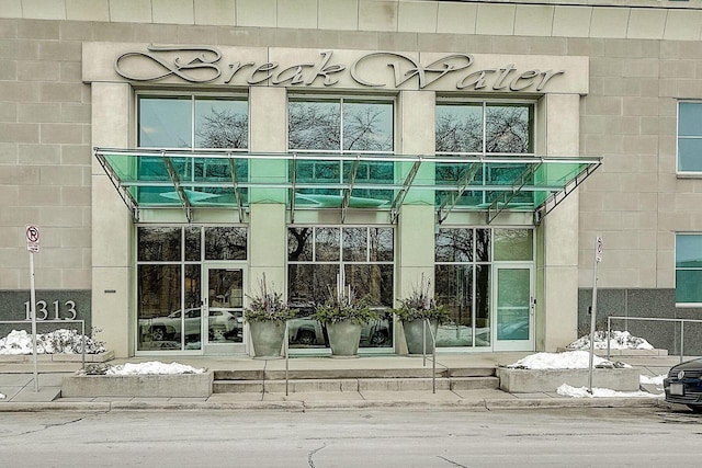 property entrance with concrete block siding