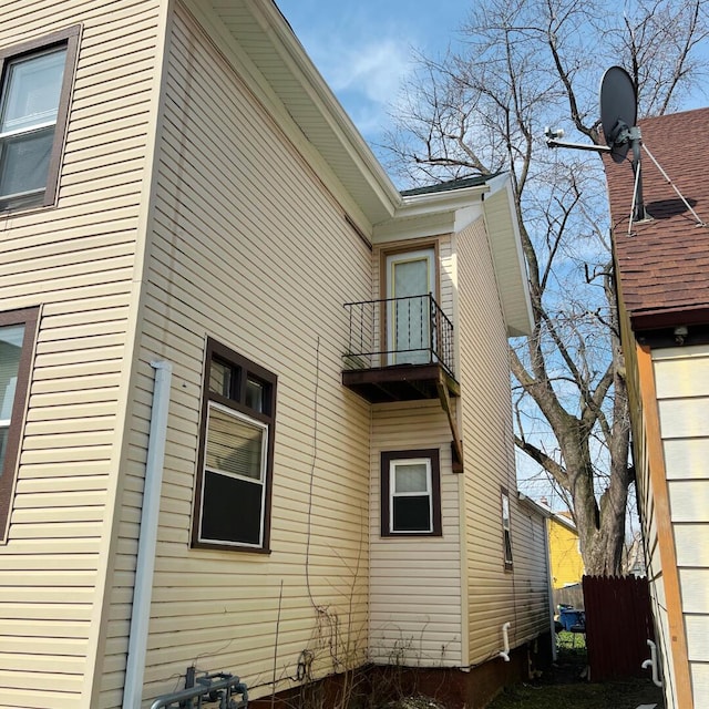 1312 Center St, Racine, WI 53403 - view of property exterior with fence and a balcony