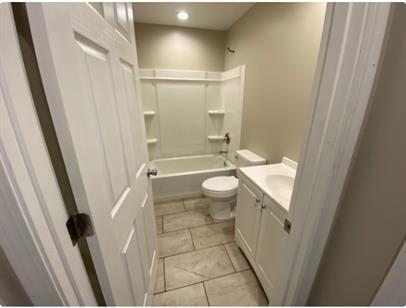 1312 Center St, Racine, WI 53403 - full bath with vanity, recessed lighting, shower / bathing tub combination, and toilet