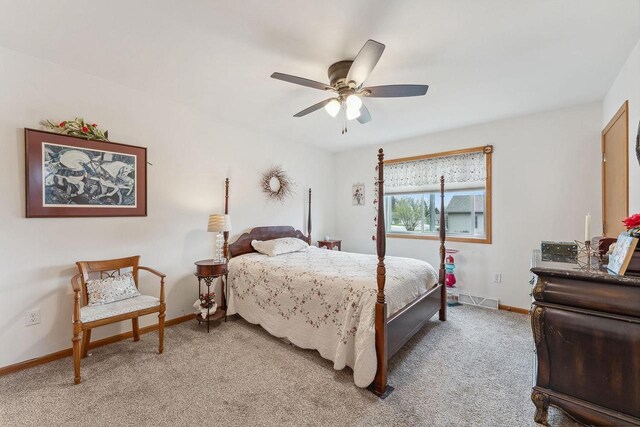 2017 Retzlaff Dr, Reedsburg, WI 53959 - bedroom with visible vents, a ceiling fan, baseboards, and light colored carpet