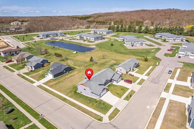 2017 Retzlaff Dr, Reedsburg, WI 53959 - birds eye view of property with a water view, a residential view, and a wooded view
