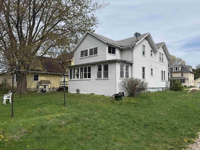view of side of property featuring a yard