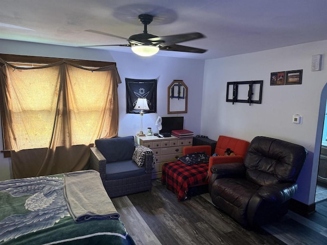 living room featuring ceiling fan and wood finished floors