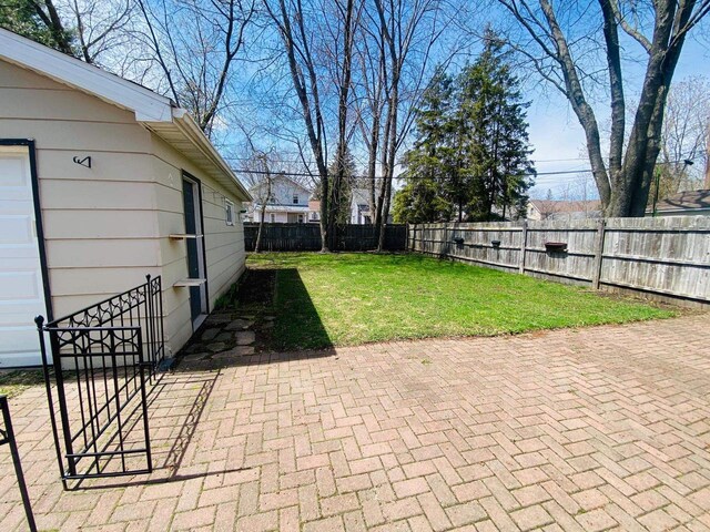 view of yard featuring a patio and a fenced backyard