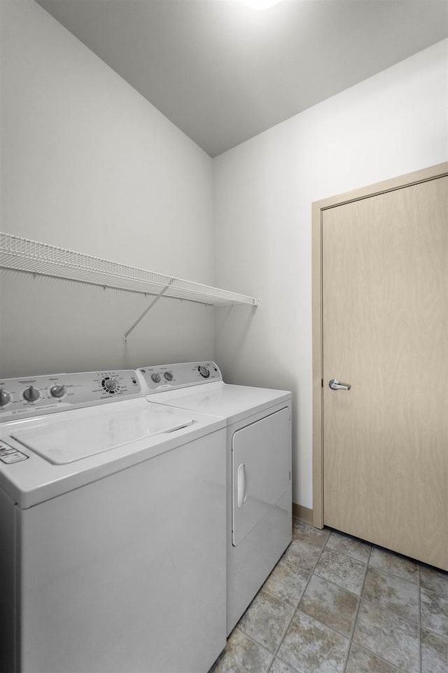 laundry area with laundry area and separate washer and dryer