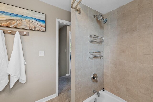 bathroom featuring  shower combination and baseboards