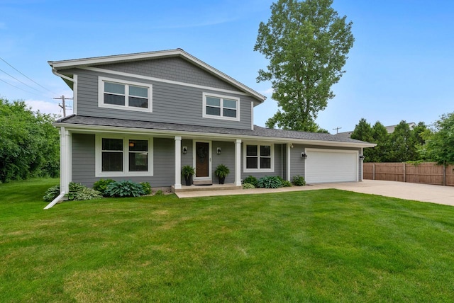 traditional-style house with covered porch, driveway, a garage, fence, and a front lawn