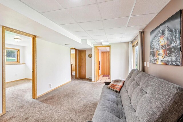 N6376 Hillcrest Rd, Pardeeville, WI 53954 - carpeted living area with baseboards and a paneled ceiling
