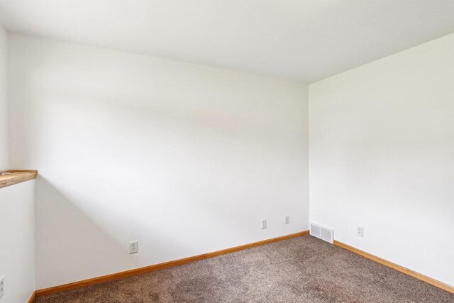 N6376 Hillcrest Rd, Pardeeville, WI 53954 - spare room with baseboards, visible vents, and carpet
