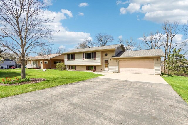 N6376 Hillcrest Rd, Pardeeville, WI 53954 - split level home with a garage, driveway, and a front yard