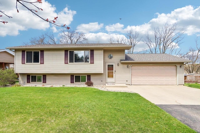 N6376 Hillcrest Rd, Pardeeville, WI 53954 - tri-level home with an attached garage, driveway, and a front lawn