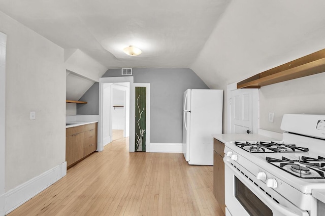 kitchen featuring white appliances, open shelves, visible vents, and light countertops