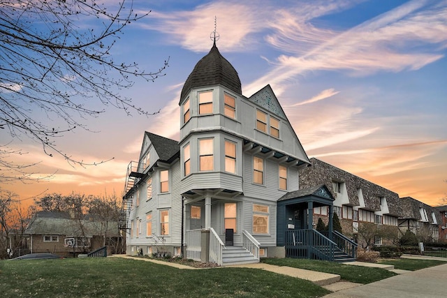 victorian-style house featuring a yard