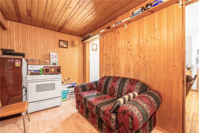 W12141 Hwy 8, Bruce, WI 54819 - living area featuring wood walls, wooden ceiling, and wood finished floors