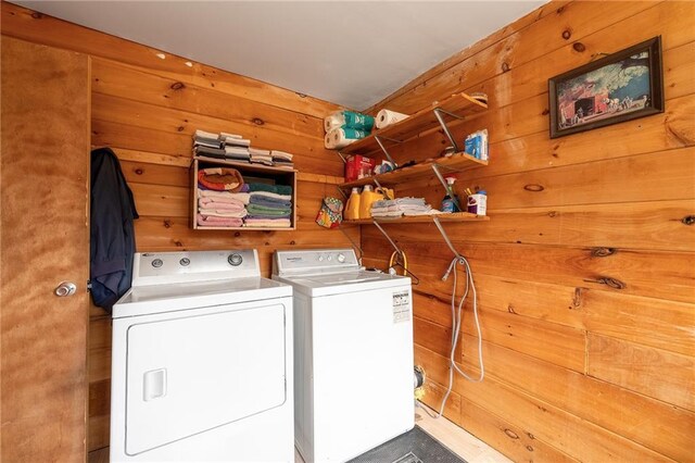 W12141 Hwy 8, Bruce, WI 54819 - laundry room with separate washer and dryer, laundry area, and wood walls