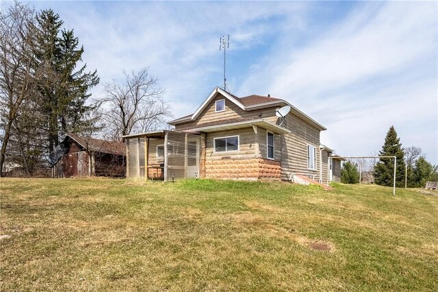 W12141 Hwy 8, Bruce, WI 54819 - back of house featuring a lawn