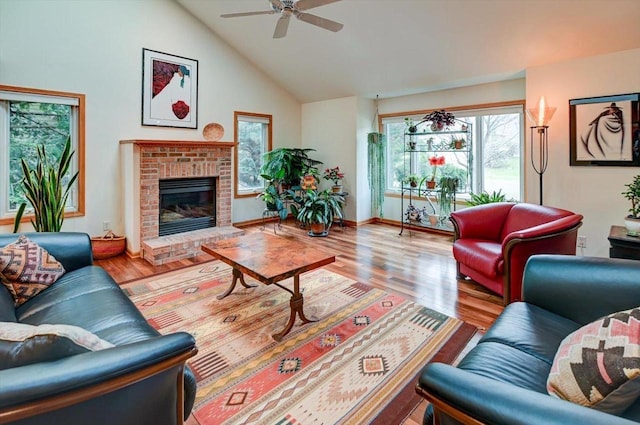 6610 Whittlesey Rd, Middleton, WI 53562 - living area with plenty of natural light, ceiling fan, wood finished floors, a fireplace, and high vaulted ceiling