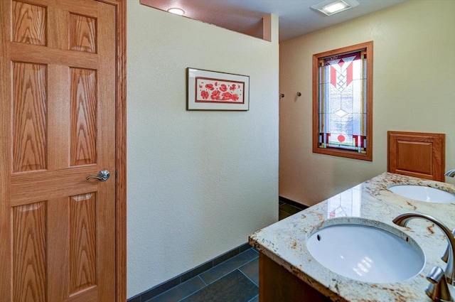6610 Whittlesey Rd, Middleton, WI 53562 - bathroom featuring double vanity and tile patterned flooring