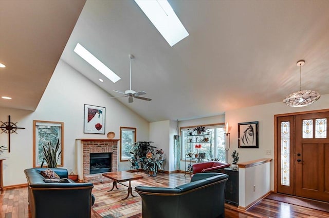 6610 Whittlesey Rd, Middleton, WI 53562 - living area with a skylight, plenty of natural light, wood finished floors, high vaulted ceiling, and recessed lighting