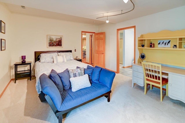 6610 Whittlesey Rd, Middleton, WI 53562 - bedroom with light colored carpet, track lighting, and baseboards