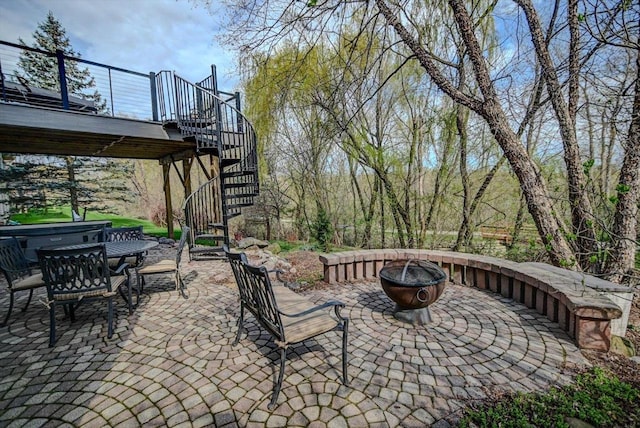 6610 Whittlesey Rd, Middleton, WI 53562 - view of patio / terrace with stairs, a fire pit, outdoor dining area, and a deck
