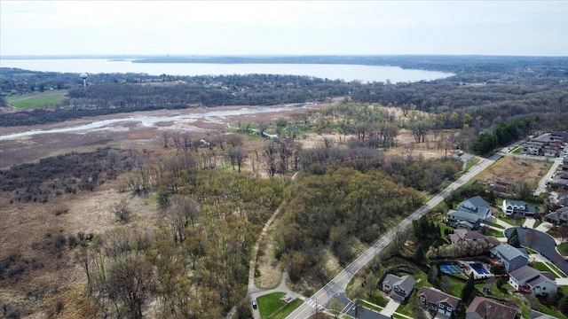 6610 Whittlesey Rd, Middleton, WI 53562 - view of property location with a nearby body of water, a heavily wooded area, and nearby suburban area