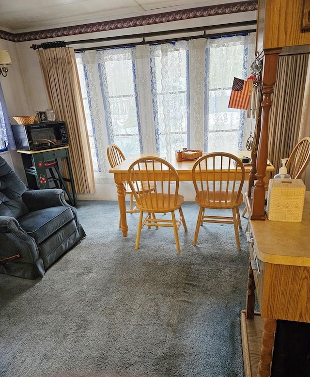 dining space with carpet flooring