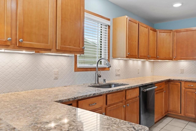 7605 W Windrush Ln, Franklin, WI 53132 - kitchen featuring a sink, dishwasher, light stone countertops, tasteful backsplash, and light tile patterned flooring