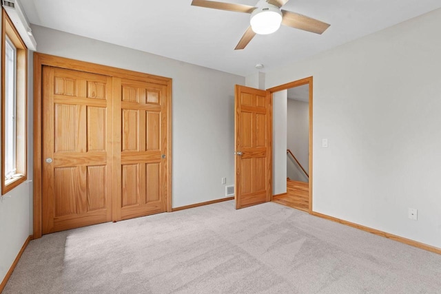 7605 W Windrush Ln, Franklin, WI 53132 - unfurnished bedroom with baseboards, carpet, and a ceiling fan