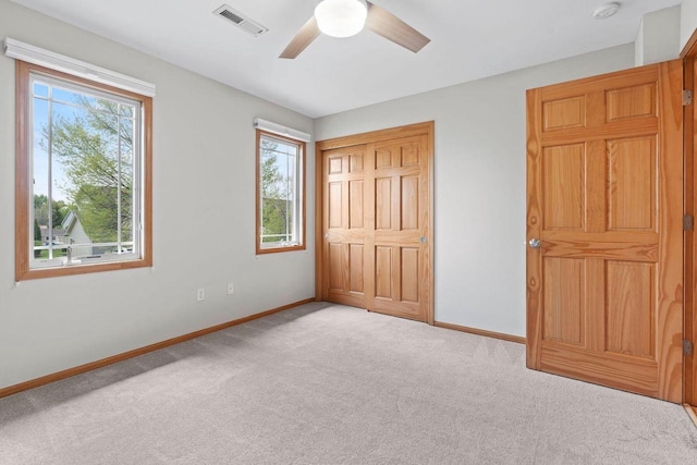 7605 W Windrush Ln, Franklin, WI 53132 - unfurnished bedroom featuring carpet flooring, baseboards, ceiling fan, and a closet