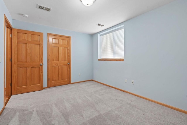 7605 W Windrush Ln, Franklin, WI 53132 - unfurnished bedroom with baseboards and carpet flooring