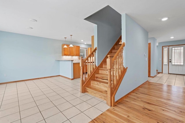 7605 W Windrush Ln, Franklin, WI 53132 - stairway with wood finished floors, baseboards, and recessed lighting