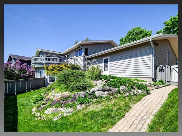 5401 Comanche Way, Madison, WI 53704 - view of front of home with fence and a wooden deck