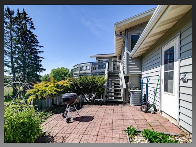 5401 Comanche Way, Madison, WI 53704 - view of patio / terrace with stairway, a wooden deck, fence, a grill, and central air condition unit