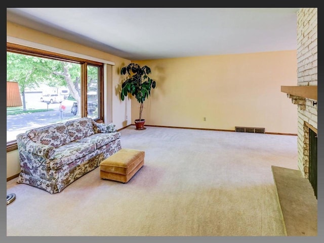5401 Comanche Way, Madison, WI 53704 - living area with a fireplace, carpet flooring, and baseboards