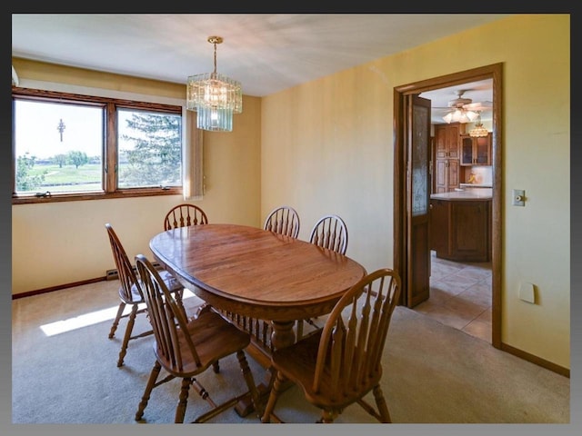 5401 Comanche Way, Madison, WI 53704 - dining room featuring light carpet, a chandelier, and baseboards