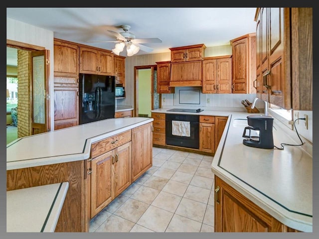 5401 Comanche Way, Madison, WI 53704 - kitchen featuring black appliances, light countertops, brown cabinetry, and ceiling fan