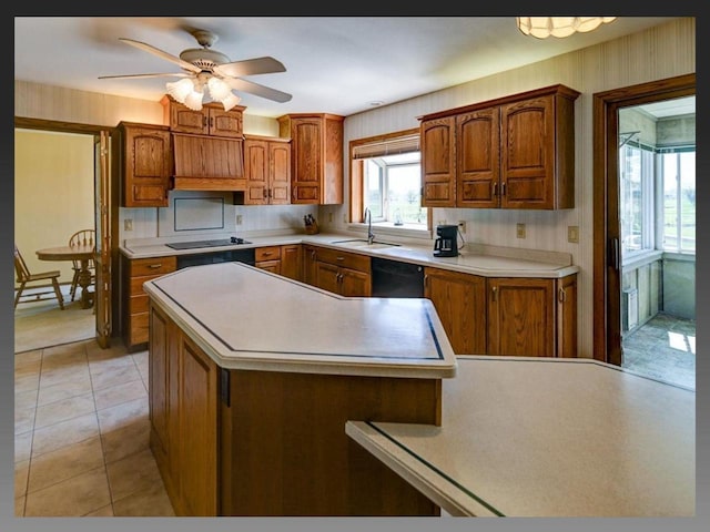 5401 Comanche Way, Madison, WI 53704 - kitchen featuring a sink, black appliances, brown cabinets, and light countertops