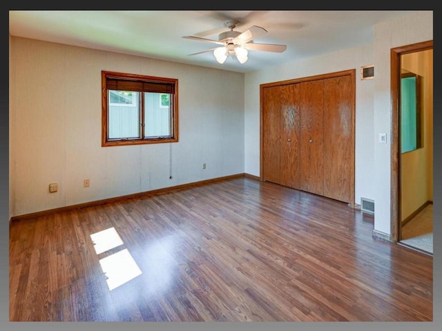 5401 Comanche Way, Madison, WI 53704 - unfurnished bedroom featuring wood finished floors, baseboards, a closet, and ceiling fan