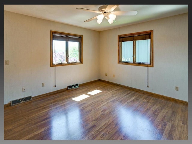 5401 Comanche Way, Madison, WI 53704 - unfurnished room featuring wood finished floors, a ceiling fan, and baseboards