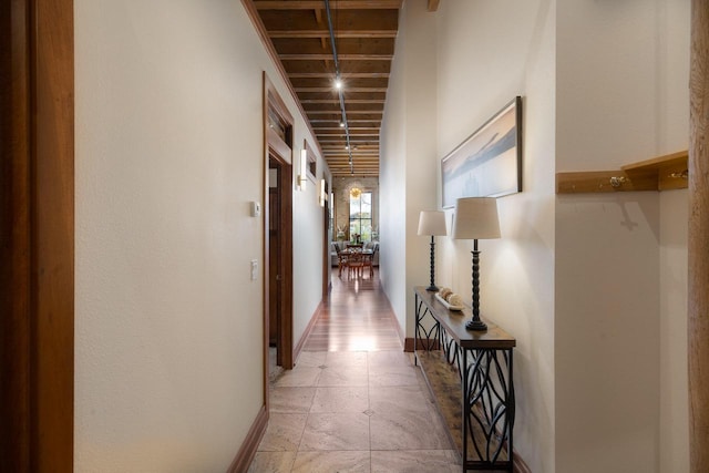 corridor featuring baseboards