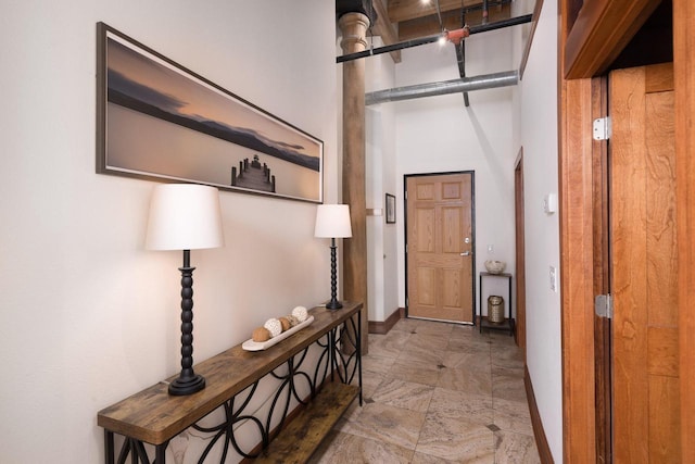 interior space featuring baseboards