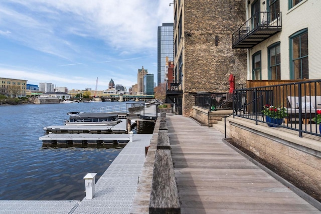 dock area with a city view and a water view