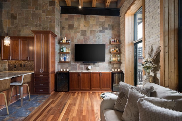 living area with light wood finished floors and wine cooler